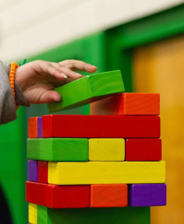 Children exploring and playing in the holistic play environment at Totland